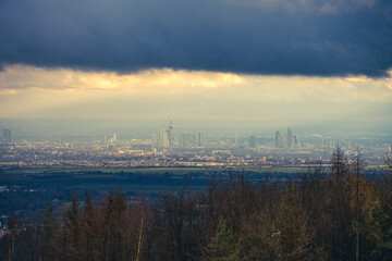 Fototapeta premium The skyline of the financial district of Frankfurt at sunset blue hour with fantastic sky and clouds