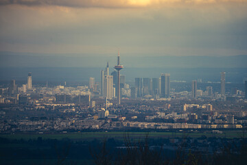 Fototapeta premium The skyline of the financial district of Frankfurt at sunset blue hour with fantastic sky and clouds