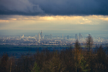 Fototapeta premium The skyline of the financial district of Frankfurt at sunset blue hour with fantastic sky and clouds
