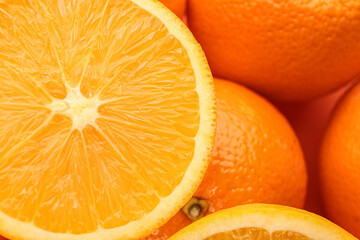 Cut and whole fresh ripe oranges as background, top view