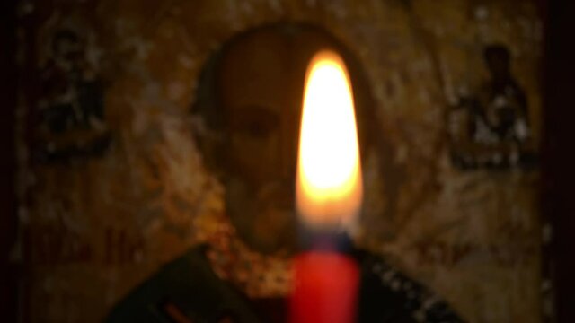 Orthodox Church Icon Saint Peter  rack focus from candle