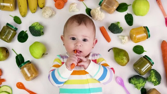 baby puree with vegetables and fruits. selective focus.