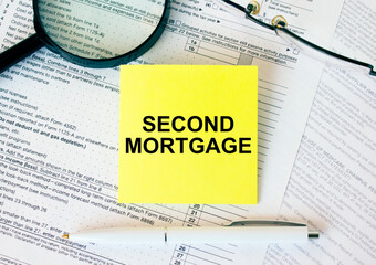 Yellow sticker with text Second Mortgage on financial docs