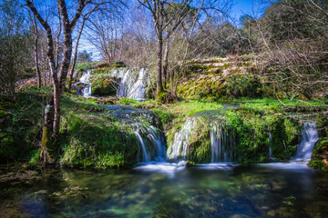 Fototapeta na wymiar River waterfall with silky water in the little village of Beselga, Portugal