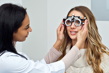 The doctor checks the patient's throat. Consultant in the ophthalmology office. Apparatus for...