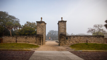 Old city gates at the north end of St. George Street in St. Augustine, FL.  Constructed 1808.  Morning lit through fog.