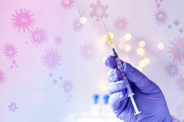 doctor, medic holds in hand a thin syringe for intramuscular injection on a technological blue...