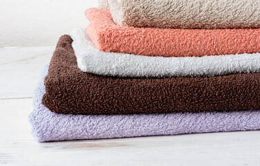 Freshly washed 100 cotton terry towels stacked on top of each other