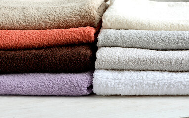 Multicolored clean terry towels in a stack