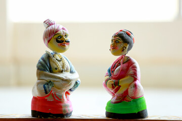 Closeup shot of traditional Indian dolls on a blurred background