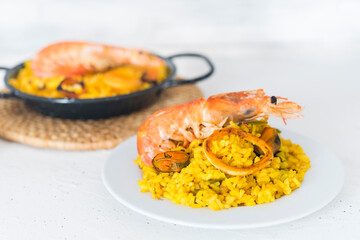 Paella typical spanish food in granite background