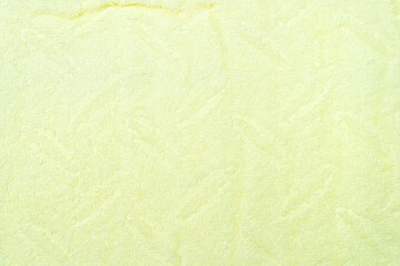 Light yellow terry towel texture for background.