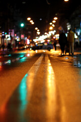 Night city wet track and lantern lights