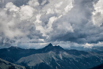 panoramic view of the Dolomites with beautiful weather clouds , Italy.