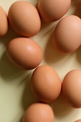 Brown eggs on a light background. View from the top.