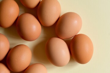 Brown eggs on a light background. View from the top.