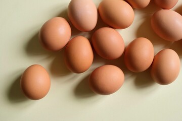 Brown eggs on a light background. View from the top.