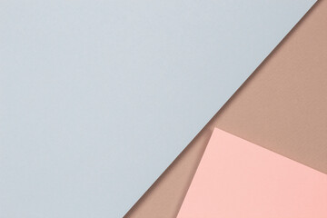 Abstract geometric shapes and lines in light blue, pastel pink colors on light brown paper background