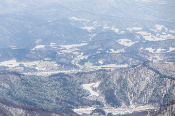 Alpencia, South Korea, 2016, Winter - Top View. Alpencia ski and biathlon center among snow-capped mountains.