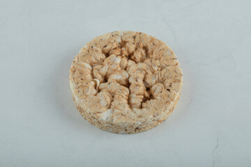 Puffed rice cake on gray wooden background