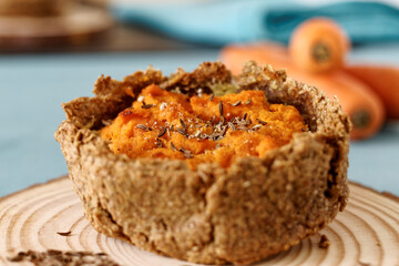 Pie with carrot and potato filling with caraway seeds. Rye flour homemade pastry.