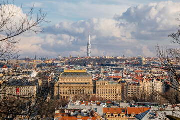 Fototapeta na wymiar Panorama aerial view of Old town cityscape from Petrin Hill, building of national theater, red roofs and Zizkov television tower in background, sunny day, Prague, Czech Republic