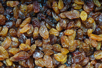 Close-up of a bunch of raisins, with out of focus background.