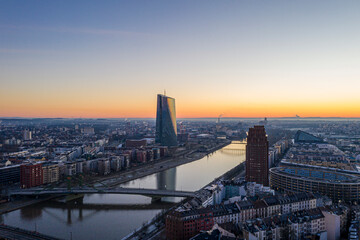 Obraz premium View over river Main in Frankfurt with Flößerbrücke and European Central Bank building with sun reflection in the facade