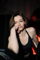 Portrait of Confident Brunette Woman Wearing Performance Wear in Gym