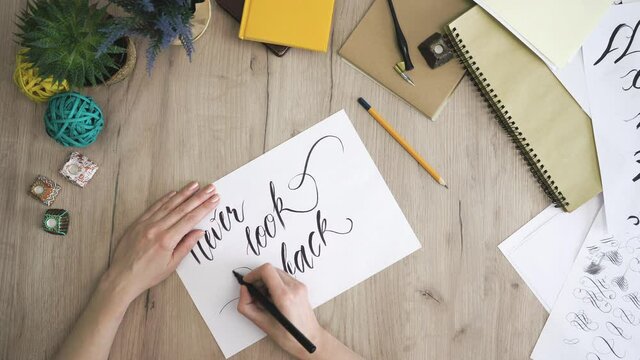 Never give up In A Paper Card Written In Calligraphy Form Drawing twirl