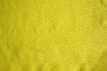 Bright yellow towel, closeup fabric texture, cozy domestic