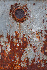 Old iron texture with the peel off paint and traces of rust, surface of the ship, eroded by time, grunge background