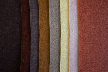 Set of colorful beige and brown felt samples, multicolor, bright, closeup as nice background