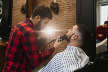 Bearded man, bearded male. Vintage barbershop, shaving. Portrait of stylish man beard. Barber scissors and straight razor, barber shop. Beard styling. Advertising barber shop concept. Black and white