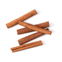 Cinnamon sticks isolated on white background closeup. Canella spice. Aromatic condiment background. Flat lay, top view.