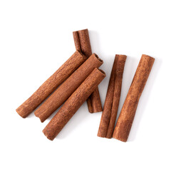 Cinnamon sticks isolated on white background closeup. Canella spice. Aromatic condiment background. Flat lay, top view.