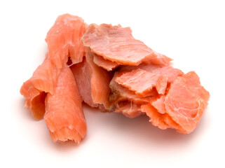 smoked salmon segments isolated on white background cutout. Prepared fish fillet fibres.
