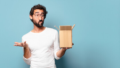 young crazy bearded man recibing a cardboard package