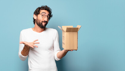 young crazy bearded man recibing a cardboard package