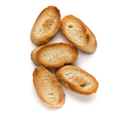 Toasted baguette slices isolated on white background close up.  Toast, crouton.   Top view.