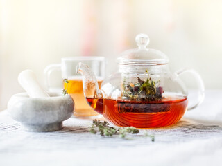 homemade herbal tea in a glass teapot