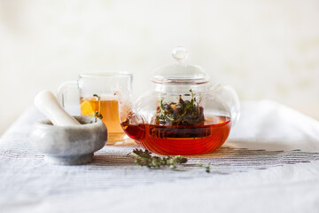 homemade herbal tea in a glass teapot
