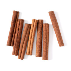 Cinnamon sticks isolated on white background closeup. Canella spice. Aromatic condiment background. Flat lay, top view.