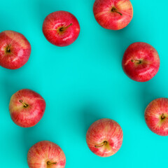 Fruit pattern of red apple on blue background. Flat lay, top view. Pop art design, creative summer concept. Food background.