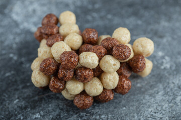 Chocolate balls corn flakes isolated on a gray background