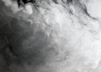 Abstract background of chaotically mixing clouds of white smoke against a background of darkness