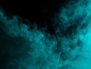 Abstract background of chaotically mixing clouds of turquoise smoke on a background of darkness