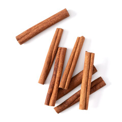 Cinnamon sticks isolated on white background closeup. Canella spice. Aromatic condiment background. Flat lay, top view.