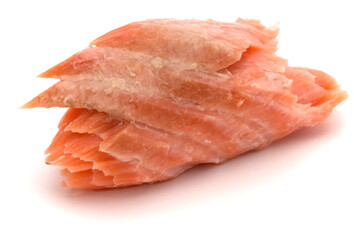 smoked salmon segments isolated on white background cutout. Prepared fish fillet fibres.