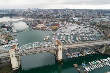 Aerial view of the Burrard Street Bridge and Granville Island in Vancouver, BC.